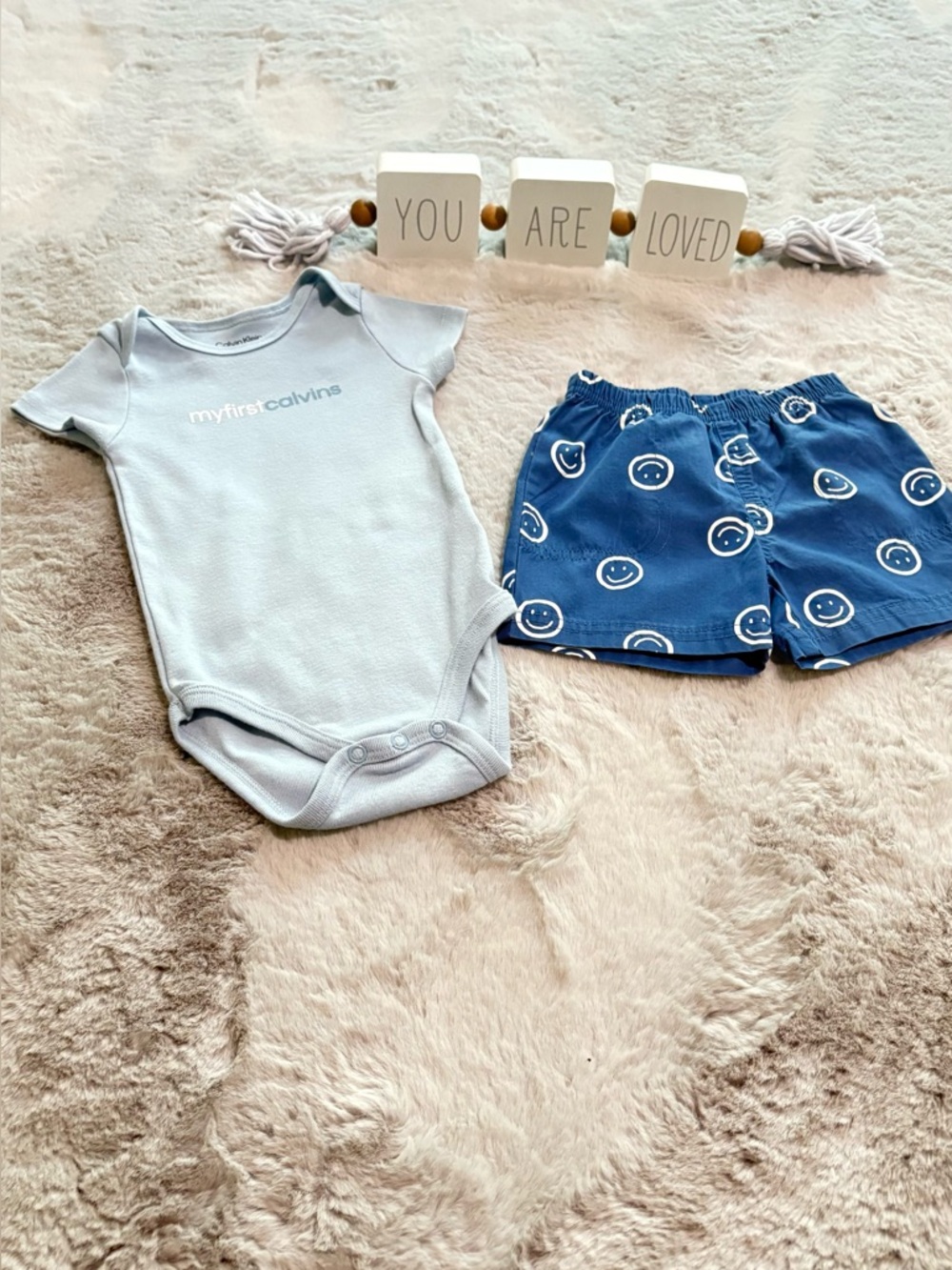Children | Calvin Klein Light Blue Onesie with Navy Blue Smiley Shorts